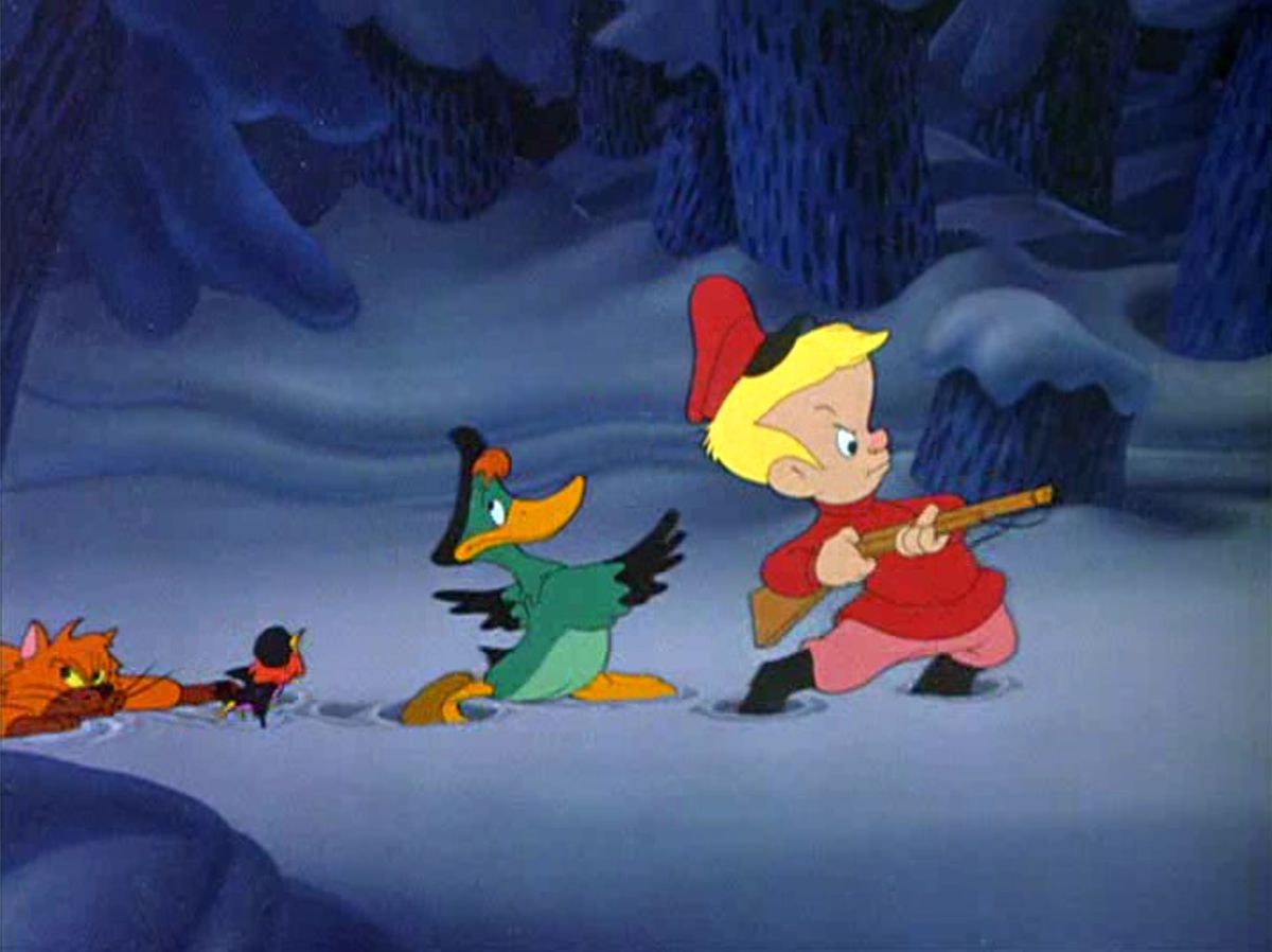 Peter, a little blond animated Russian boy in a red cap and sweater totes his pop-gun through the snowy woods with a determined expression as his friends, a duck, a tiny red-haired Cossack-hatted bird, and a slinking cat, creep through the snow behind him in Disney’s short “Peter and the Wolf”