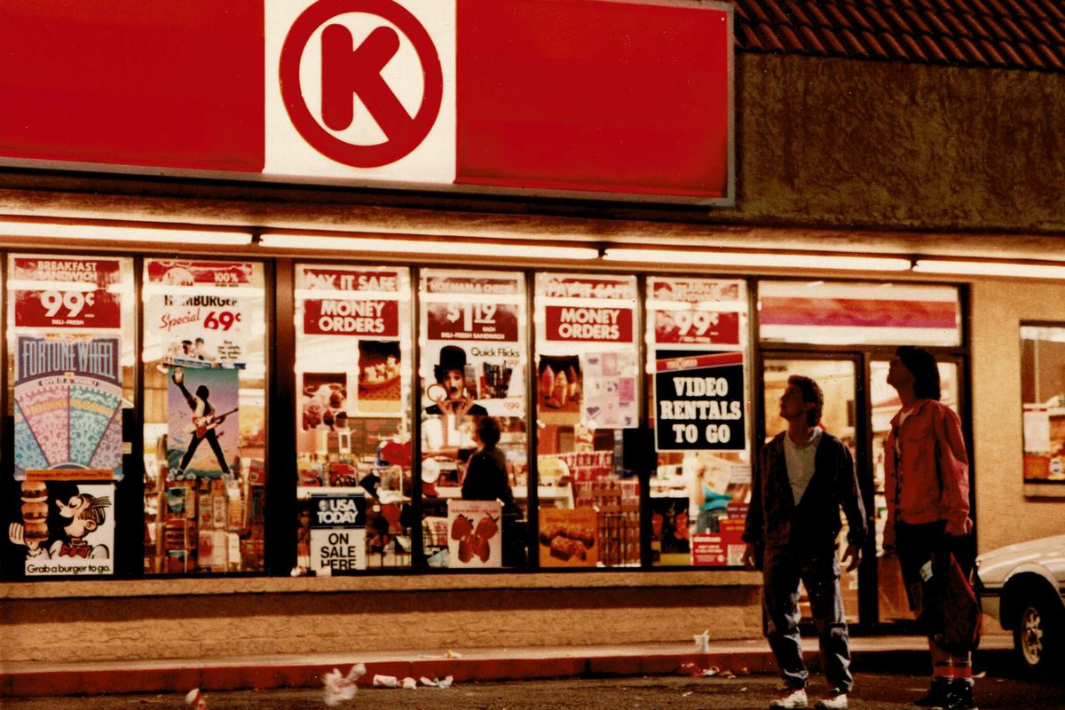 Actors Keanu Reeves and Alex Winter stand outside of a Circle-K in a still from ‘Bill and Ted’s Excellent Adventure’