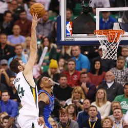 Utah Jazz center Jeff Withey (24) puts in a shot over Oklahoma City Thunder guard Russell Westbrook (0) as the Jazz and the Thunder play at Vivint Smart Home arena in Salt Lake City on Wednesday, Dec. 14, 2016.