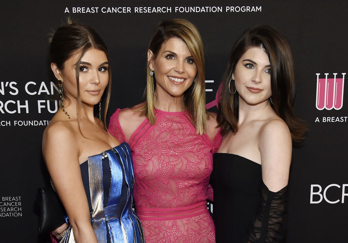 In this Feb. 28, 2019 file photo, actress Lori Loughlin, center, poses with daughters Olivia Jade Giannulli, left, and Isabella Rose Giannulli at the 2019 “An Unforgettable Evening” in Beverly Hills, Calif. | AP photo