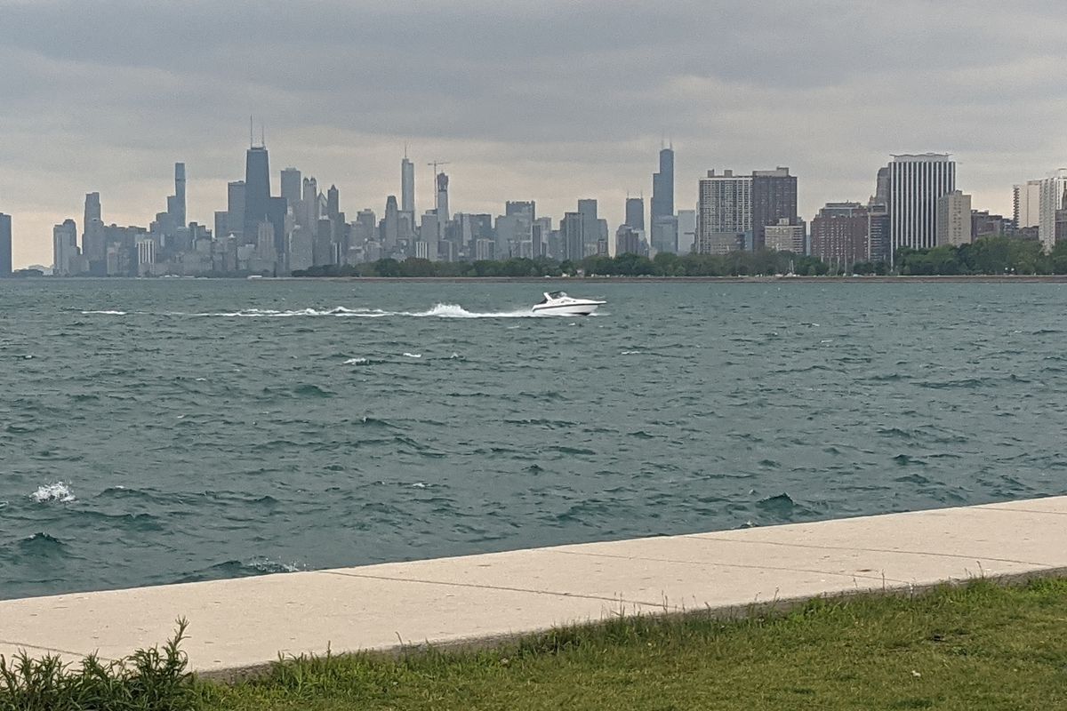 A boat speeds back in May toward Montrose Harbor in the middle of the best view of downtown Chicago from the south side of Montrose. Credit: Dale Bowman