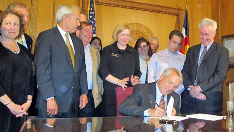 Gov. Bill Ritter signs Senate Bill 10-003 on June 9. Those attending included Nancy McCallin, community college system president (at left); CU President Bruce Benson (next to McCallin), and bill sponsors Mike May (behind Benson), Karen Middleton (behind Ritter) and John Morse (far right). Photo courtesy governor's press office.