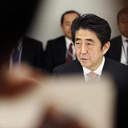 Japanese Prime Minister Shinzo Abe speaks at a meeting with a panel of experts at his official residence in Tokyo, Wednesday, Feb. 25, 2015. The panel of experts appointed by Abe met for the first time Wednesday to discuss what he should say in a statement marking the 70th anniversary of the end of World War II, fueling speculation that he may water down previous government apologies for the country's wartime past. 