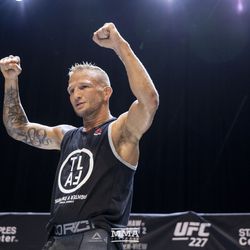 T.J. Dillashaw plays to the crowd at the UFC 227 open workouts in Los Angeles, California.