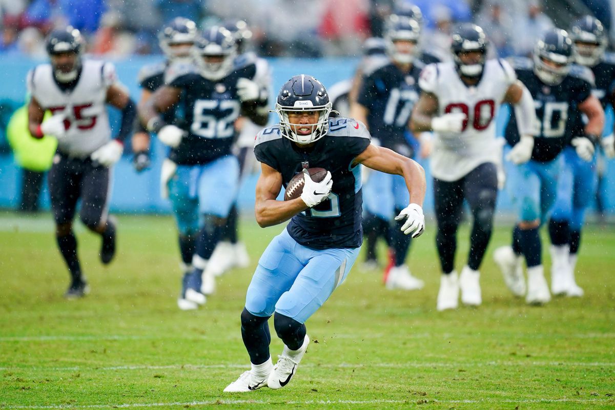 Tennessee Titans wide receiver Nick Westbrook-Ikhine (15) runs the ball during the third quarter at Nissan Stadium Sunday,