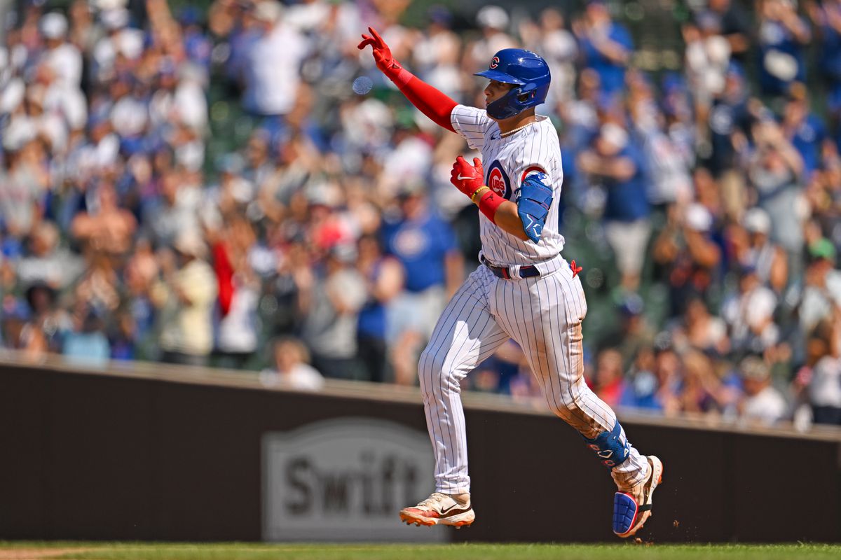 Miguel Amaya of the Chicago Cubs celebrates after a home run in the eighth inning off Jordan Lyles of the Kansas City Royals at Wrigley Field on August 20, 2023 in Chicago, Illinois.