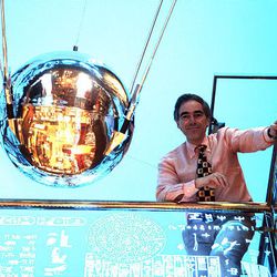 Priceline.com founder Jay Walker shows off what he says is a 1957 Soviet Sputnik satellite that he bought on eBay.