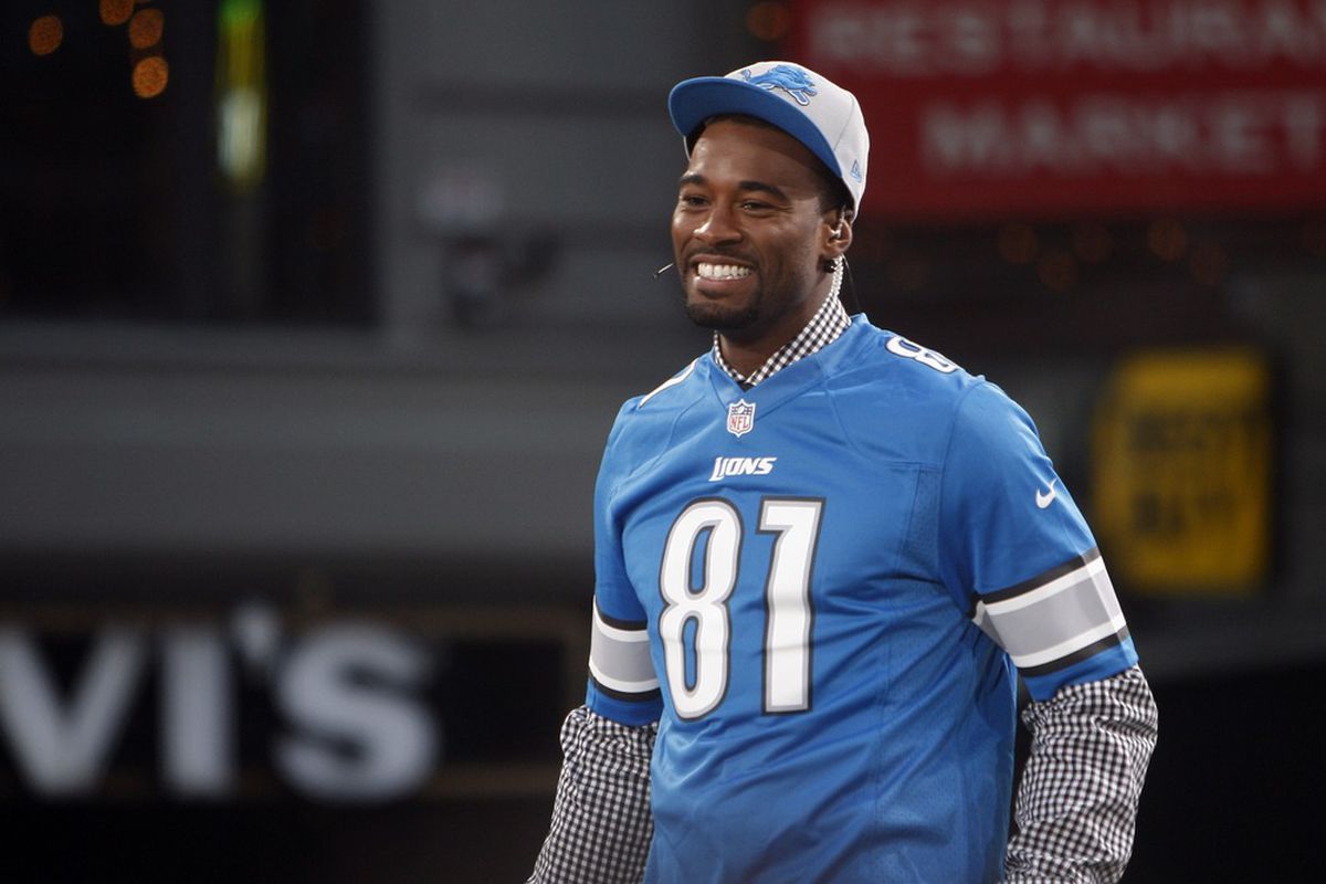 Apr 25, 2012; New York, NY, USA; Detroit Lions receiver Calvin Johnson reacts after being named the cover athlete during the Madden 13 cover unveiling on the set of SportsNation at Times Square.  Mandatory Credit: Jerry Lai-US PRESSWIRE