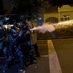 Brazilian police shoot tear gas at demonstrators during an anti-government protest in Rio de Janeiro's sister city, Niteroi, Brazil, Wednesday evening, June 19, 2013. Rio de Janeiro and Sao Paulo city leaders said Wednesday that they reversed an increase in bus and subway fares that ignited anti-government protests. Many people doubted the move would quiet the demonstrations which have moved well beyond outrage over the fare hikes into communal cries against poor public services. 