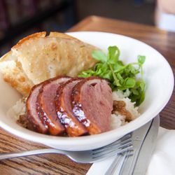 Ssam Bar duck over rice by <a href="http://www.flickr.com/photos/chris6sigma/5819170536/in/pool-eater/">ExFlexitarian</a>.