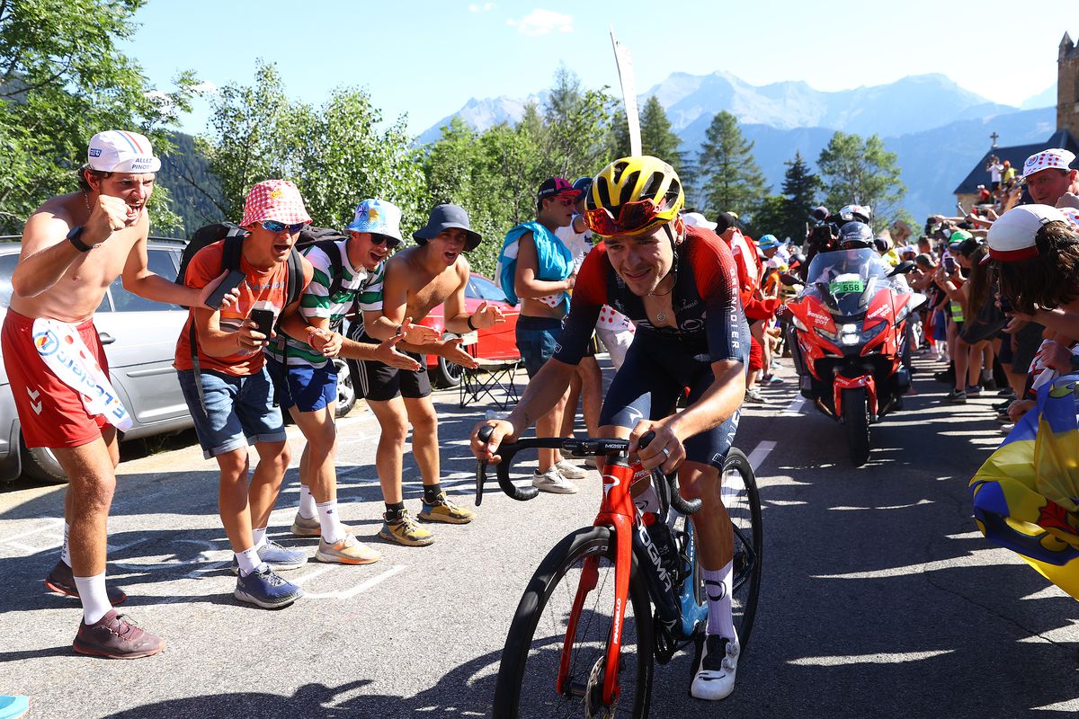 Thomas Pidcock of United Kingdom and Team INEOS Grenadiers attacks in the breakaway passing through The Dutch corner climbing to the L’Alpe d’Huez while fans cheer during the 109th Tour de France 2022, Stage 12 a 165,1km stage from Briançon to L’Alpe d’Huez 1471m / #TDF2022 / #WorldTour / on July 14, 2022 in Alpe d’Huez, France.