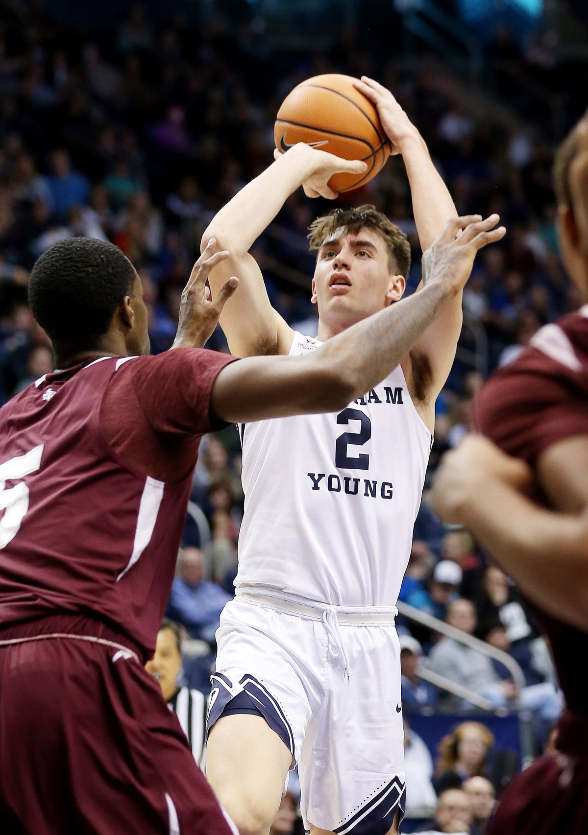 BYU guard Zac Seljaas shoots over Texas Southern center Trayvon Reed at the Marriott Center on Saturday, Dec. 23, 2017. BYU won 73-52.