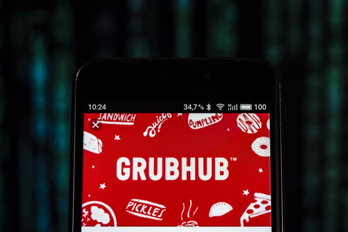 GrubHub logo seen displayed on smart phone. Grubhub Inc. is