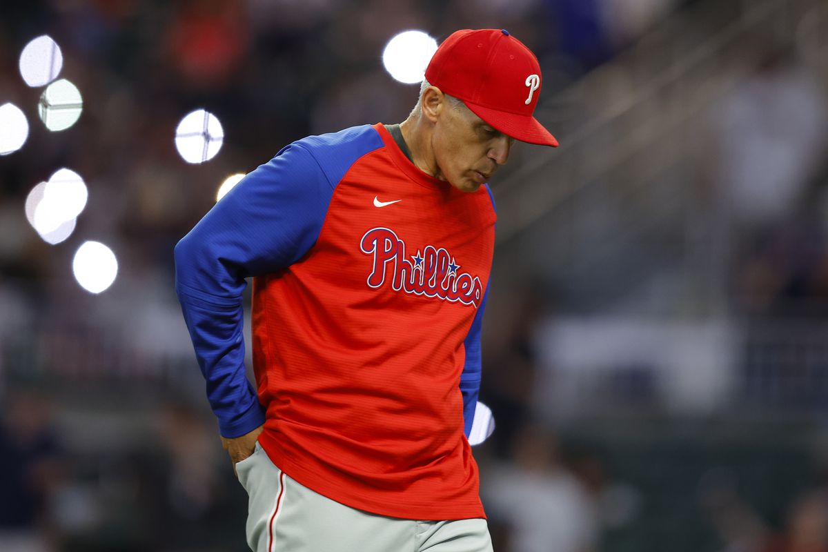 Manager, Joe Girardi of the Philadelphia Phillies returns to the dugout after a pitching change during the ninth inning against the Atlanta Braves at Truist Park on May 26, 2022 in Atlanta, Georgia.