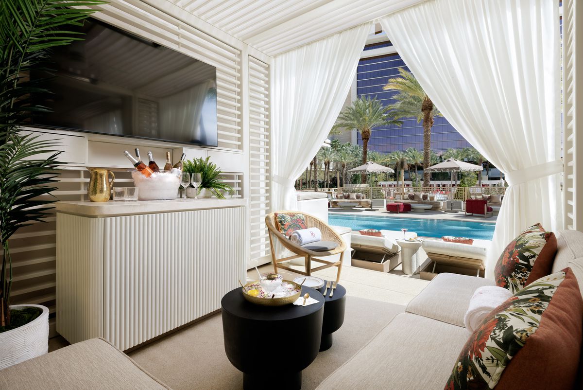 A cabana overlooking a small pool.