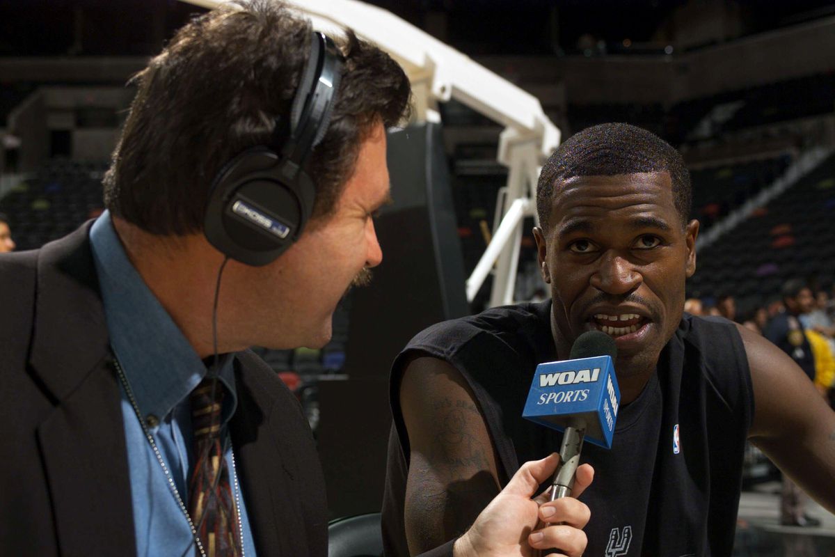 Stephen Jackson # 3 of the San Antonio Spurs talks with Spurs Announcer Bill Schoening after the Spurs beat the Houston Rockets