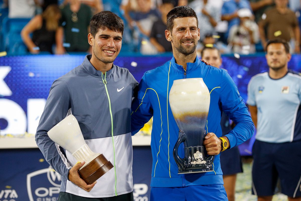 Carlos Alcaraz of Spain stands with Novak Djokovic of Serbia after the final round at the Western &amp; Southern Open at Lindner Family Tennis Center on August 20, 2023 in Mason, Ohio.