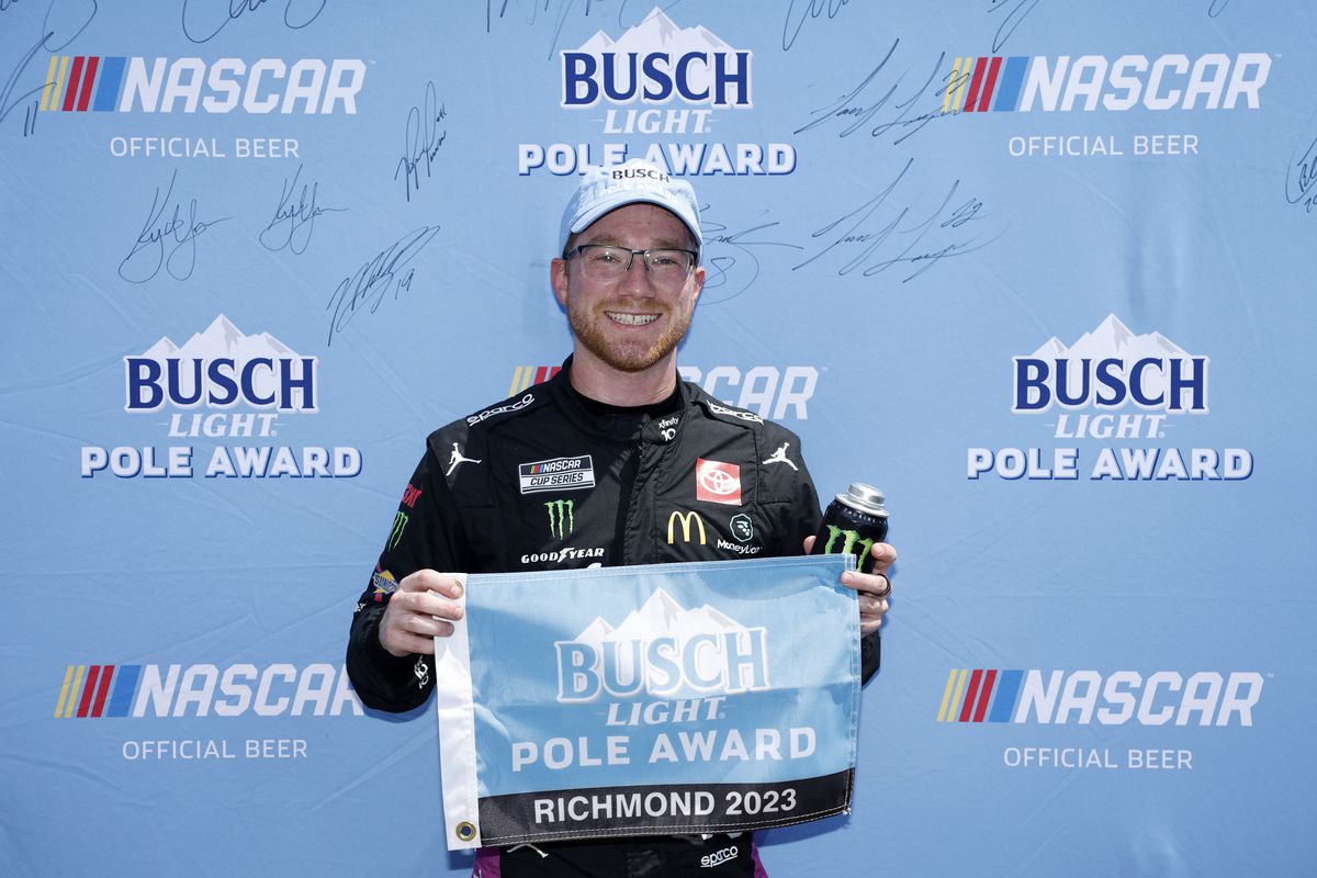 Tyler Reddick, driver of the #45 Xfinity 10G Network Toyota, poses for photos after winning the pole award during qualifying for the NASCAR Cup Series Cook Out 400 at Richmond Raceway on July 29, 2023 in Richmond, Virginia.