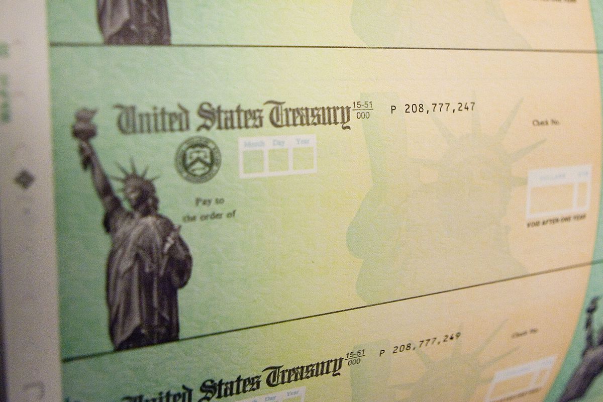 Blank checks from the United States Treasury featuring a picture of the Statue of Liberty.