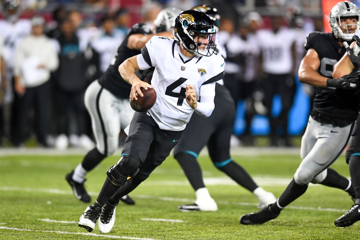Kyle Sloter #4 of the Jacksonville Jaguars looks to pass during the second half of the 2022 Pro Football Hall of Fame Game against the Las Vegas Raiders at Tom Benson Hall of Fame Stadium on August 04, 2022 in Canton, Ohio.