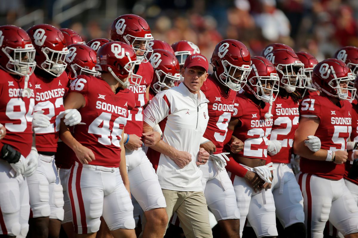 Oklahoma Sooners head coach Brent Venables walks with his team before the Red River Showdown college football game between the University of Oklahoma and Texas at the Cotton Bowl in Dallas, Saturday, Oct. 8, 2022.
