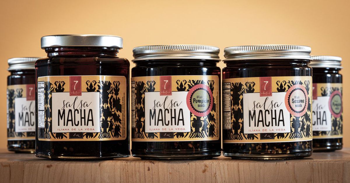 Five jars of a dark brown substance with labels that read “Salsa Macha”.