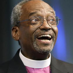 Bishop Michael Curry, of North Carolina, smiles after being elected the Episcopal Church's first African-American presiding bishop at the Episcopal General Convention Saturday, June 27, 2015, in Salt Lake City. Curry won the vote in a landslide. 