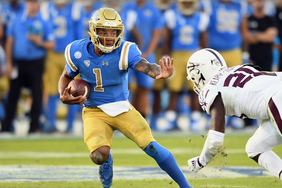 UCLA Bruins quarterback Dorian Thompson-Robinson tries to avoid being tackled by Arizona State Sun Devils linebacker Khaylan Kearse-Thomas (20) during a college football game played on October 26, 2019 at the Rose Bowl in Pasadena, CA.