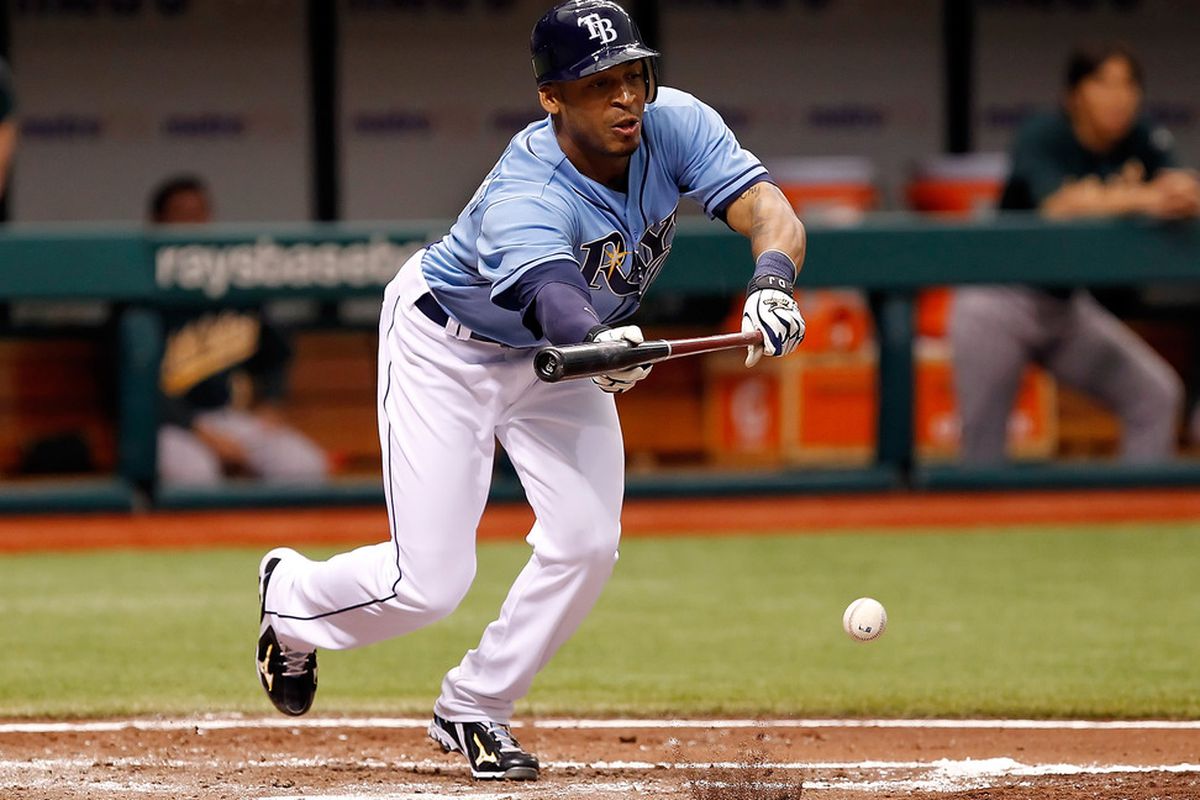 ST. PETERSBURG, FL - AUGUST 07:  Outfielder Desmond Jennings #8 of the Tampa Bay Rays bunts against the Oakland Athletics during the game at Tropicana Field on August 7, 2011 in St. Petersburg, Florida.  (Photo by J. Meric/Getty Images)