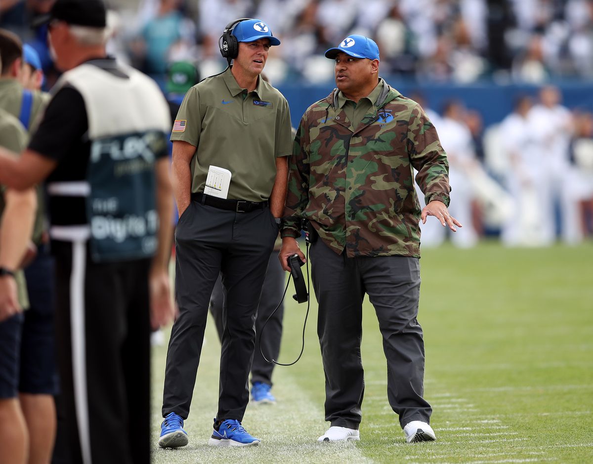 BYU assistant head coach, special teams coordinator and safeties coach Ed Lamb talks with head coach Kalani Sitake as the BYU Cougars and the Idaho State Bengals play at LaVell Edwards Stadium in Provo on Saturday, Nov. 6, 2021.