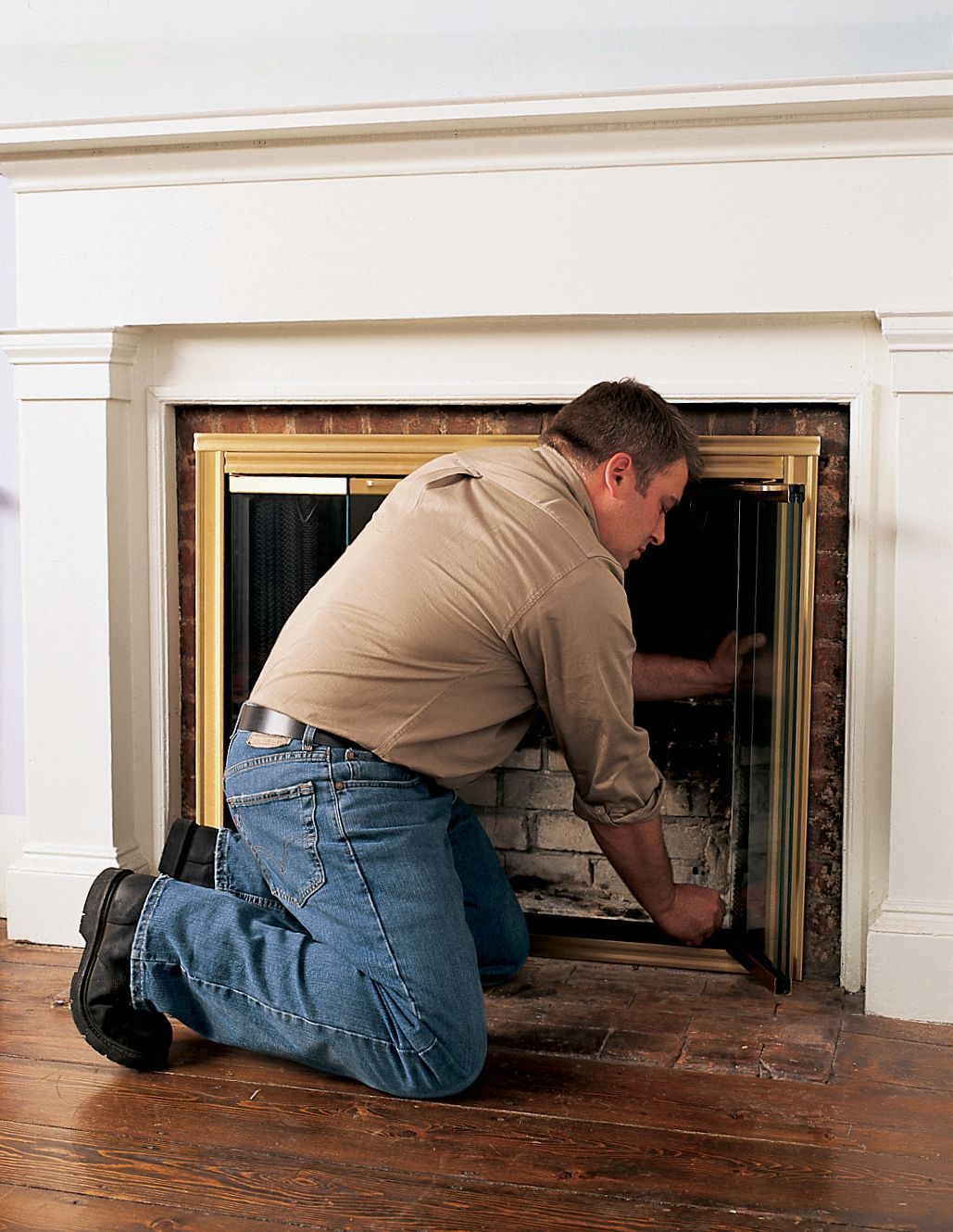 Person adding markers around fireplace doors. 