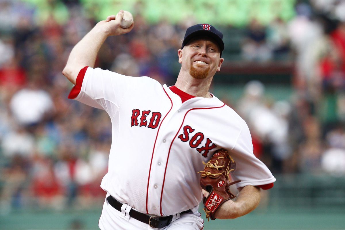 Aug 1, 2012; Boston, MA, USA; Boston Red Sox starting pitcher Aaron Cook (35) pitches against the Detroit Tigers during the first inning at Fenway Park.  Mandatory Credit: Mark L. Baer-US PRESSWIRE