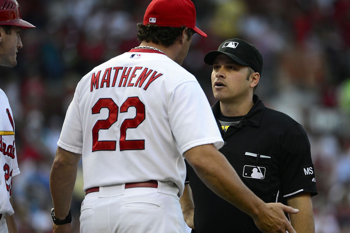 Mike Matheny asks a short umpire serious questions about life's mysteries. David Freese follows to intimidate with added handsomeness.