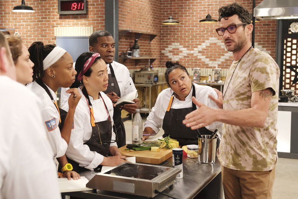 Chef Sam Talbot talks strategy with his “Top Chef: Houston” team.
