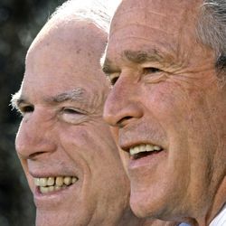 President George W. Bush  with McCain  in the Rose Garden.