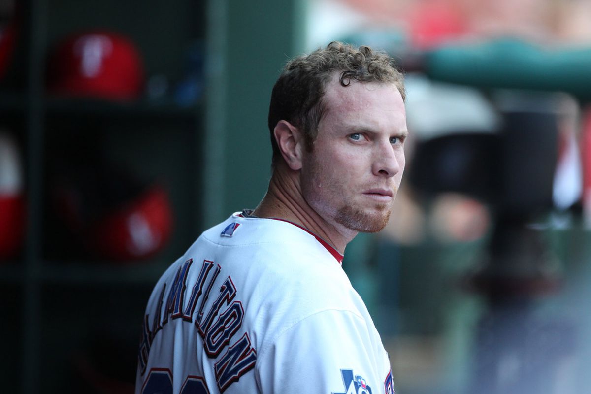 July 6, 2012; Arlington, TX, USA; Texas Rangers outfielder Josh Hamilton (32) in the dugout in the first inning against the Minnesota Twins at Rangers Ballpark.  Mandatory Credit: Matthew Emmons-US PRESSWIRE