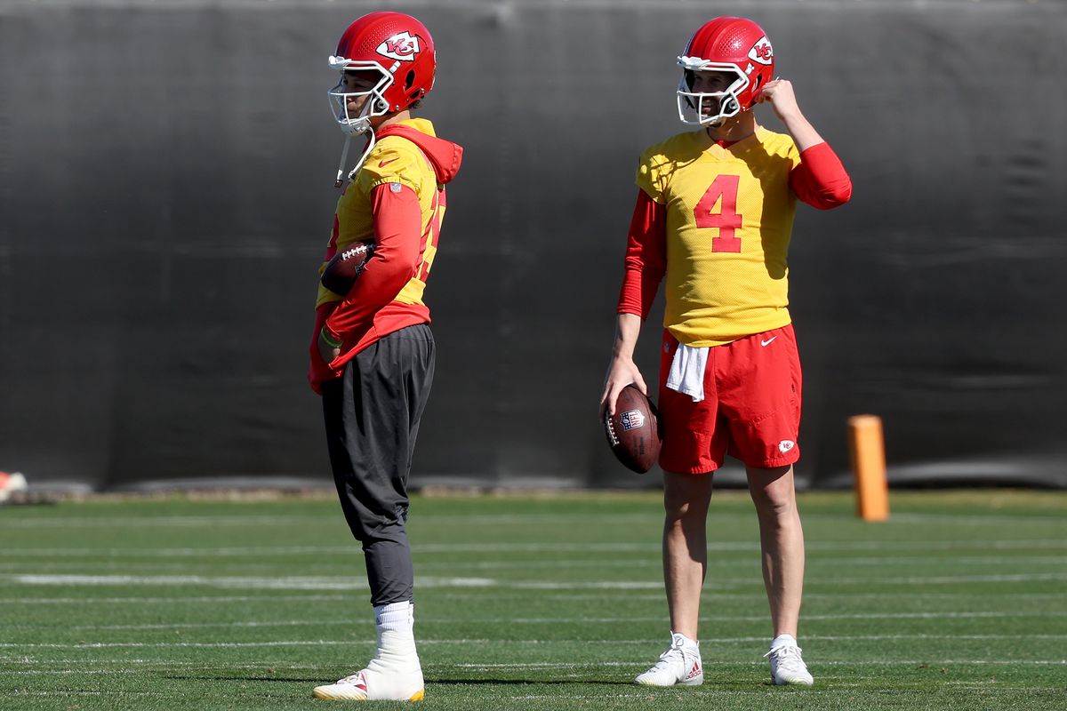 Patrick Mahomes #15 and Chad Henne #4 of the Kansas City Chiefs participate in a practice session prior to Super Bowl LVII at Arizona State University Practice Facility on February 10, 2023 in Tempe, Arizona.