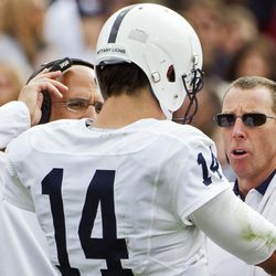 FILE – In this Jan. 2, 2016, file photo, Penn State athletic trainer Tim Bream, right, and head coach James Franklin, left, check on injured quarterback Christian Hackenberg prior to his leaving the game in the first half of the TaxSlayer Bowl NCAA college football game against Georgia in Jacksonville, Fla. Bream could testify as a preliminary hearing resumes for members of a fraternity facing criminal charges over the death of a pledge. A district judge in Pennsylvania plans Wednesday, Aug. 30, 2017, to take up a defense request to hold Bream in contempt. (AP Photo/Mark Wallheiser, File)