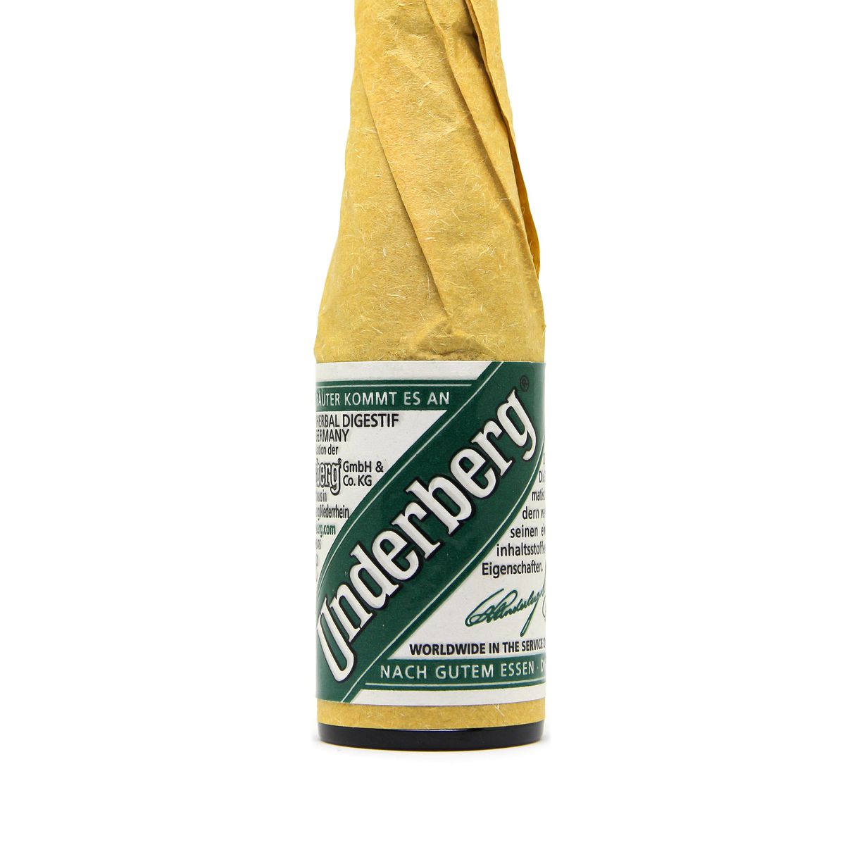 A little bottle of alcohol drink of Underberg on a white background.