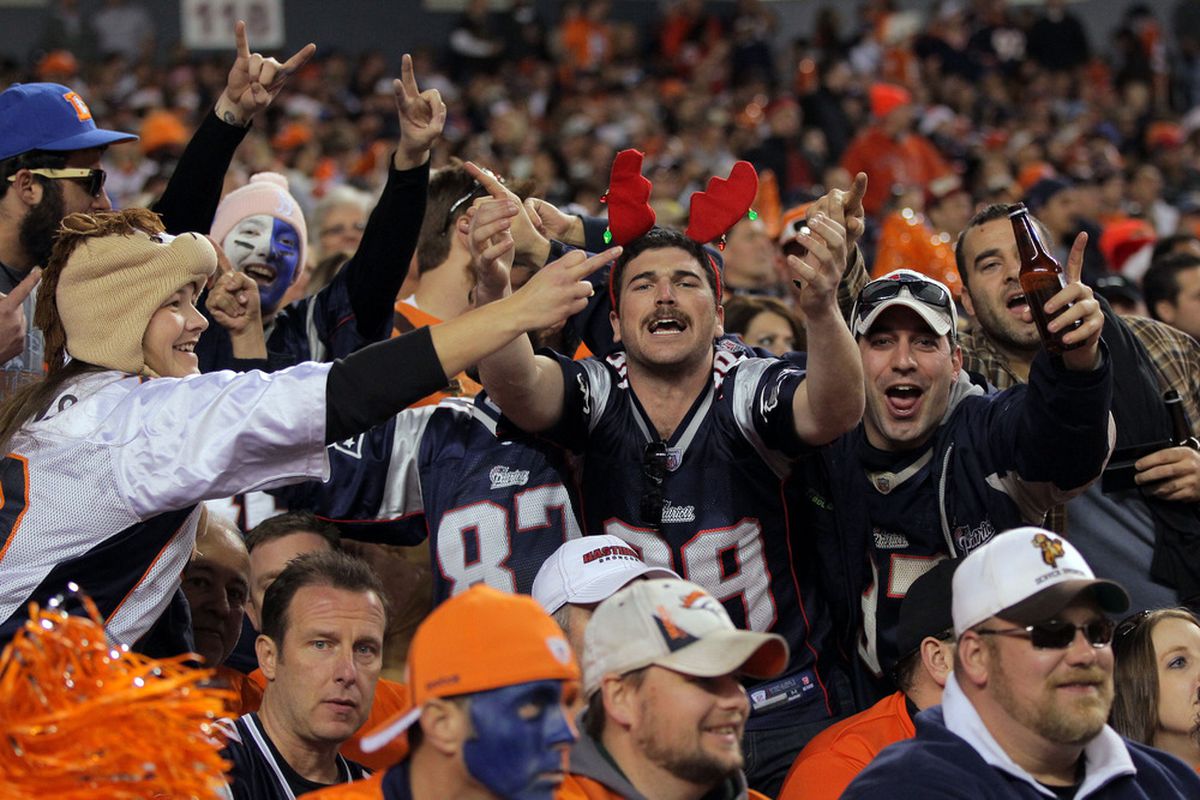 DENVER, CO - DECEMBER 18:  New England Patriots fans celebrate during a game against the Denver Broncos at Sports Authority Field at Mile High on December 18, 2011 in Denver, Colorado.  (Photo by Doug Pensinger/Getty Images)