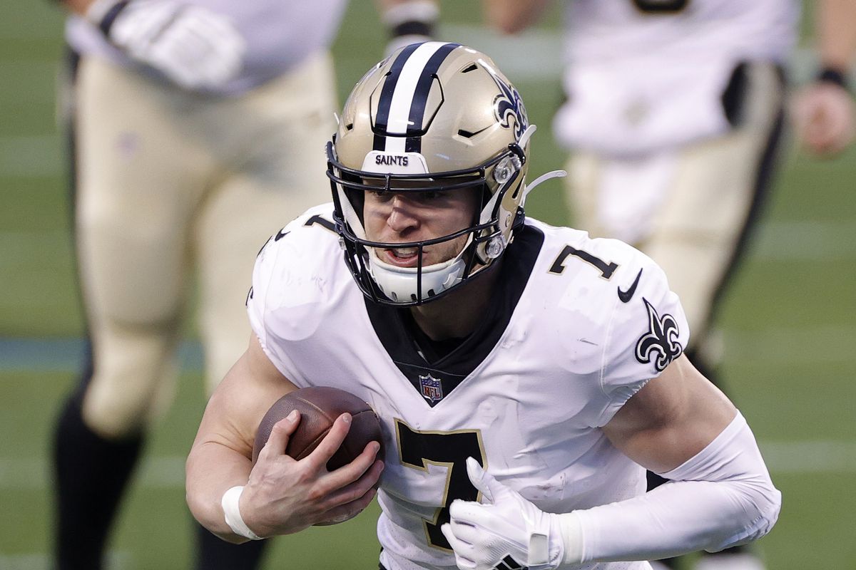 Quarterback Taysom Hill of the New Orleans Saints carries the ball during the first quarter of their game against the Carolina Panthers at Bank of America Stadium on January 03, 2021 in Charlotte, North Carolina.
