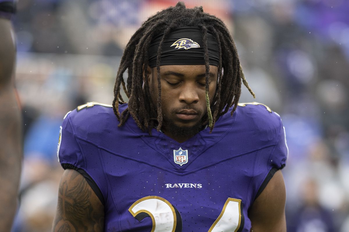 Keaton Mitchell #34 of the Baltimore Ravens looks on during the national anthem prior to an NFL football game between the Baltimore Ravens and the Los Angeles Rams at M&amp;T Bank Stadium on December 10, 2023 in Baltimore, Maryland.