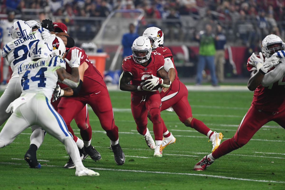 Chase Edmonds #2 of the Arizona Cardinals runs with the ball against the Indianapolis Colts at State Farm Stadium on December 25, 2021 in Glendale, Arizona.