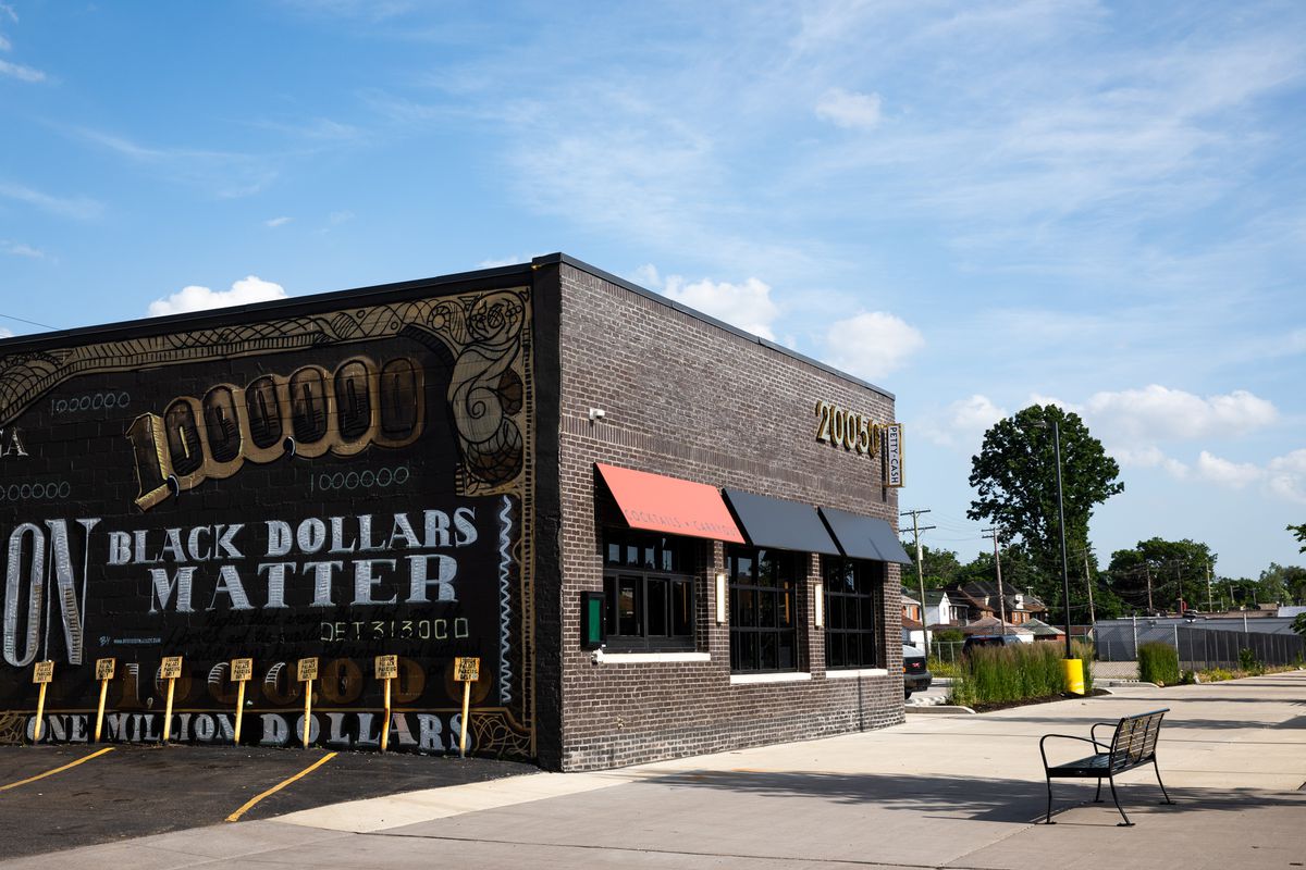 A mural in black white and gold that says black dollars matter.