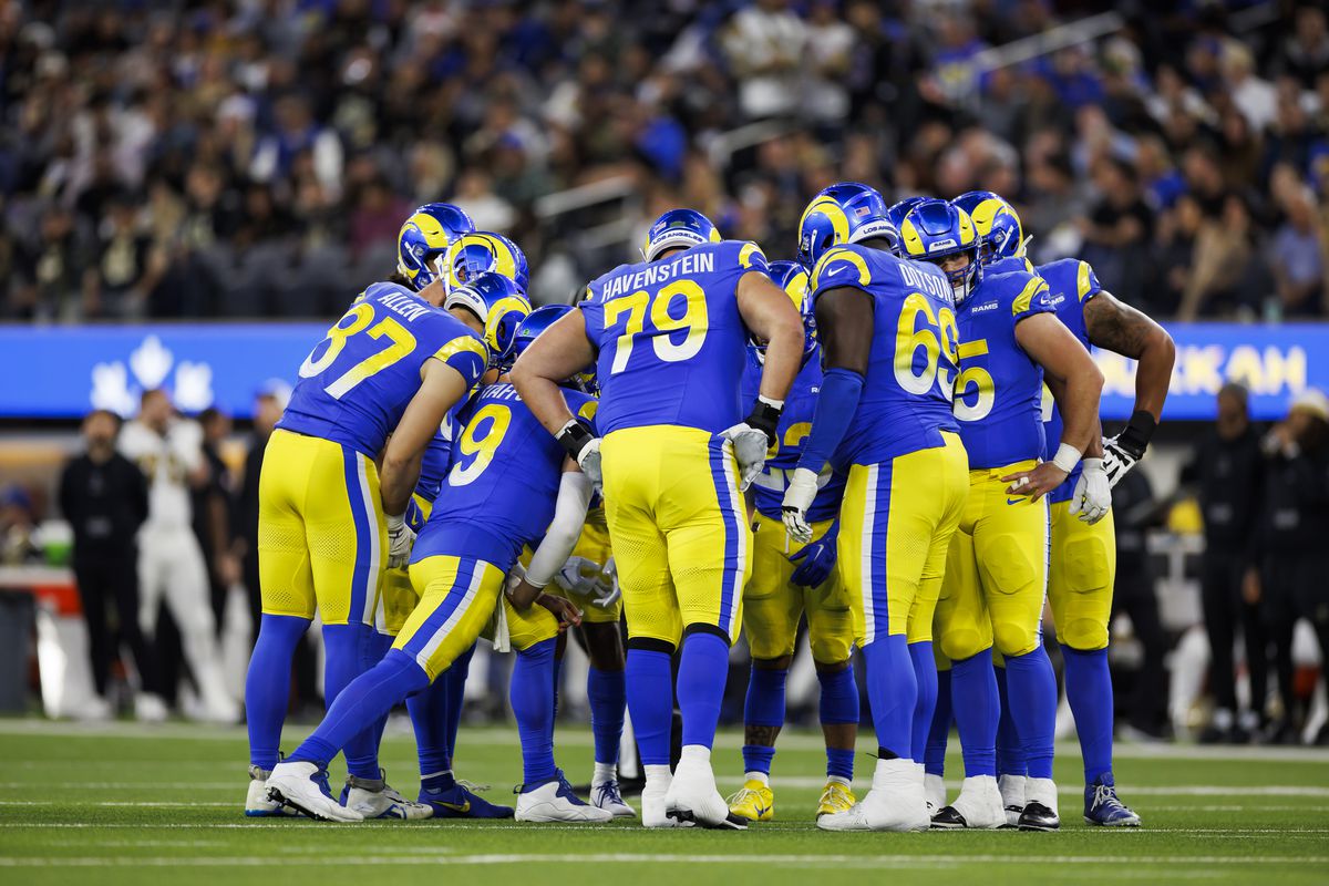 The Los Angeles Rams huddle on offense during an NFL game against the New Orleans Saints at SoFi Stadium on December 21, 2023 in Inglewood, California.