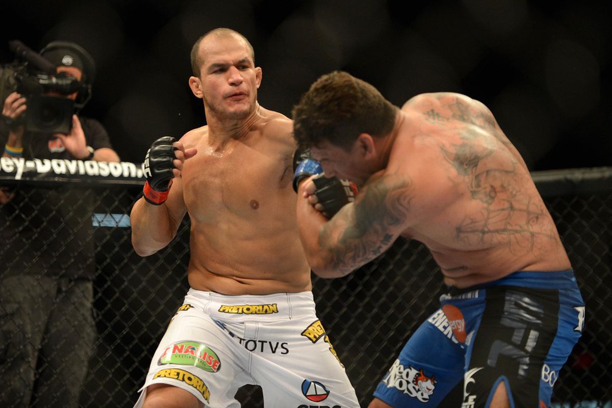 May 26, 2012; Las Vegas, NV, USA; Junior Dos Santos (left) connects with a punch on Frank Mir (right) during the UFC 146 at the MGM Grand Garden event center. Mandatory Credit: Ron Chenoy-US PRESSWIRE