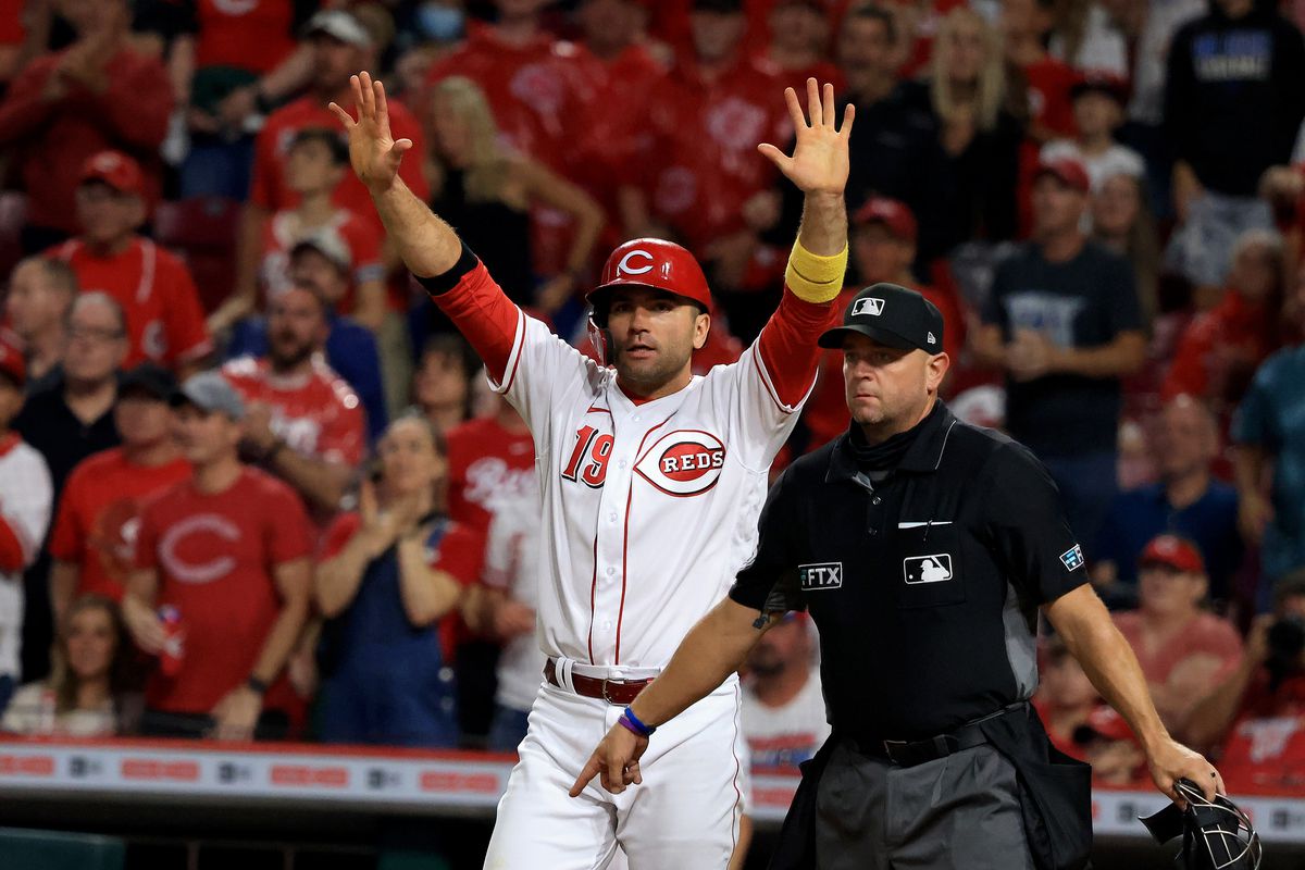 Joey Votto of the Cincinnati Reds directs his teammates during the seventh inning in the game against the Detroit Tigers at Great American Ball Park on September 04, 2021 in Cincinnati, Ohio.