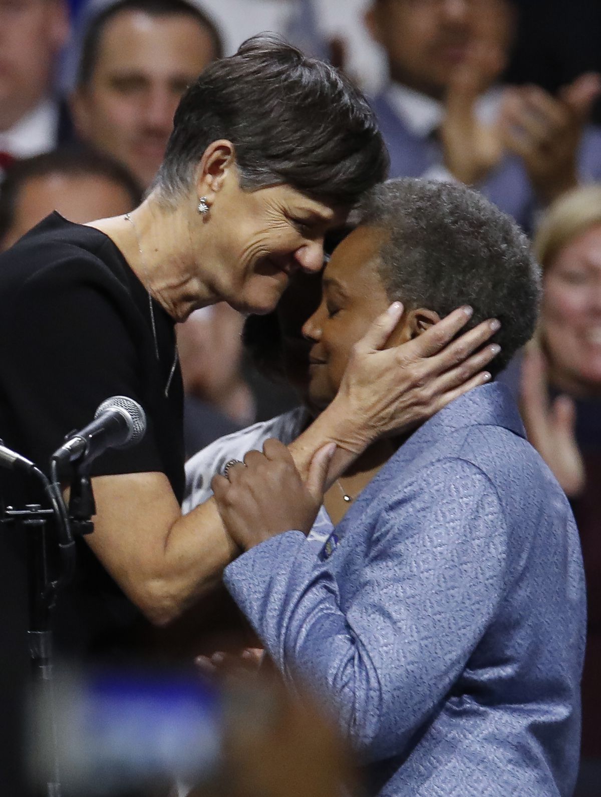 Mayor Lori Lightfoot embraces her wife Amy Eshleman at the mayor’s inauguration ceremony on May 20.