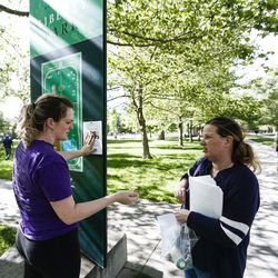 Sandy resident Heather Okiishi and her niece, Nicole Brown, who are family friends of Mackenzie Lueck, post and hand out flyers pleading that people keep an eye out for her at Liberty Park in Salt Lake City on Saturday, June 22, 2019.