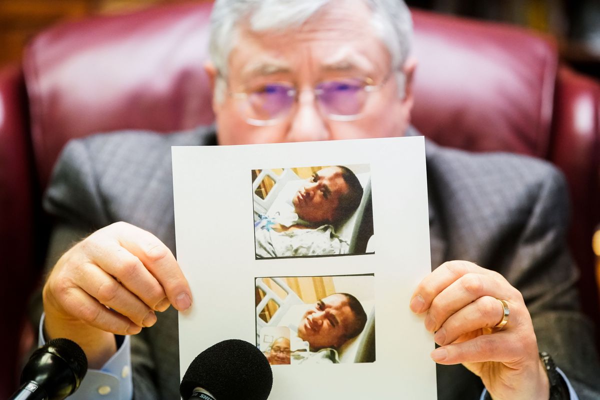 Lawyer Robert B. Sykes shows a recent photograph of Atonio Sivatia, taken in the hospital, during a press conference.
